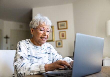 Senior uses a laptop computer