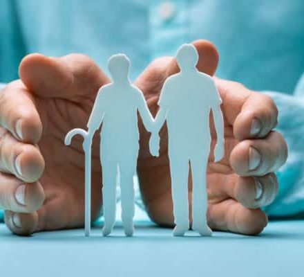 Hand Protecting Senior Couple