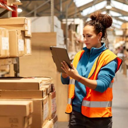 warehouse worker takes inventory in storage room