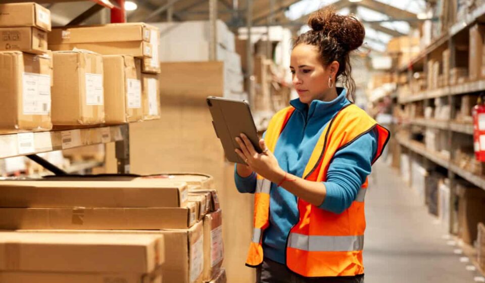 warehouse worker takes inventory in storage room
