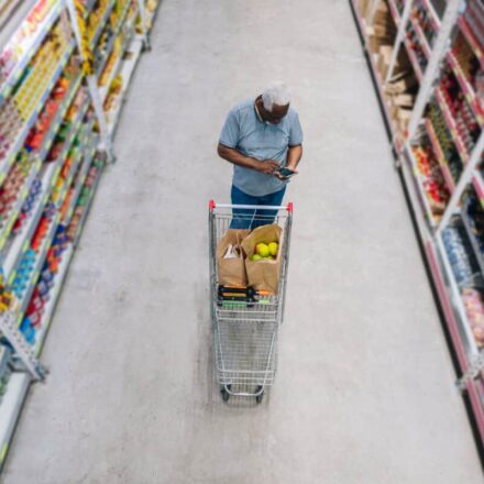 man shops at grocery store