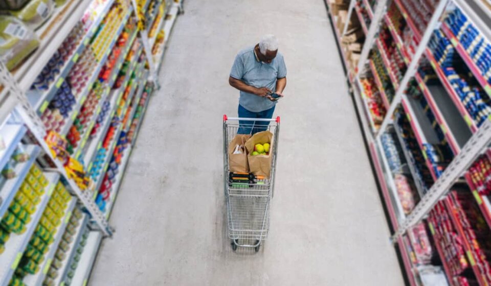 man shops at grocery store