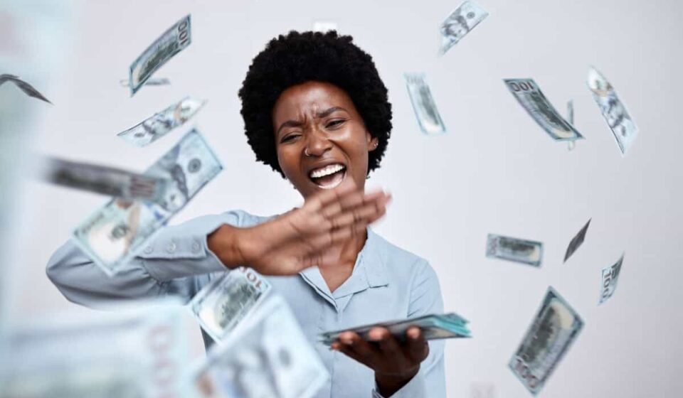 happy woman throws cash